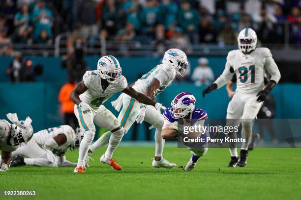 Josh Allen of the Buffalo Bills dives with the ball during an NFL football game against the Miami Dolphins at Hard Rock Stadium on January 7, 2024 in...