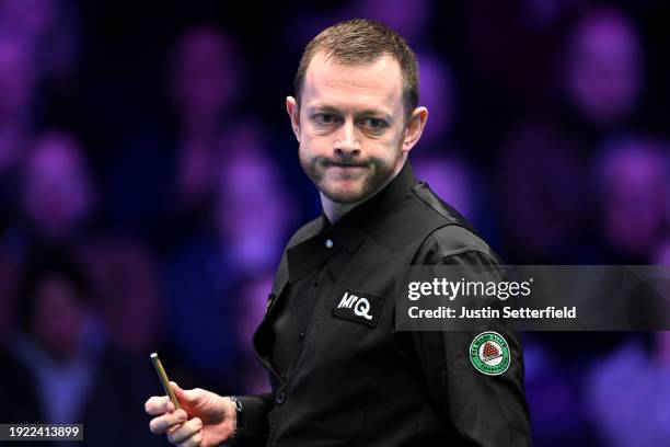Mark Allen of England reacts during his first round match against John Higgins of Scotland on day four of the MrQ Masters Snooker 2024 at Alexandra...
