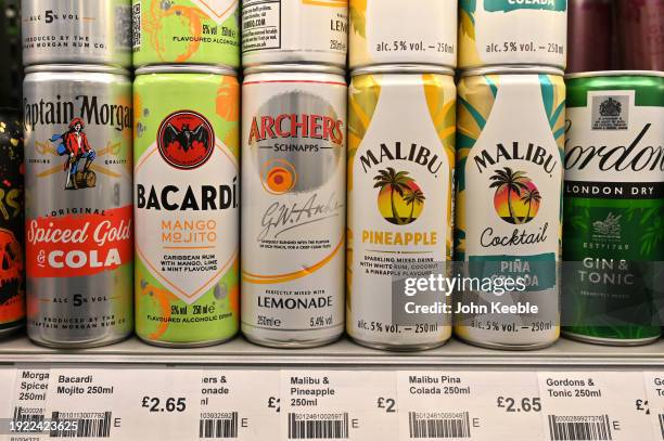 Various cans of alcoholic ready-to-drink beverages including Captain Morgan Rum and Coke, Bacardi MoJito, Archers and Lemonade, Malibu and Pineapple,...