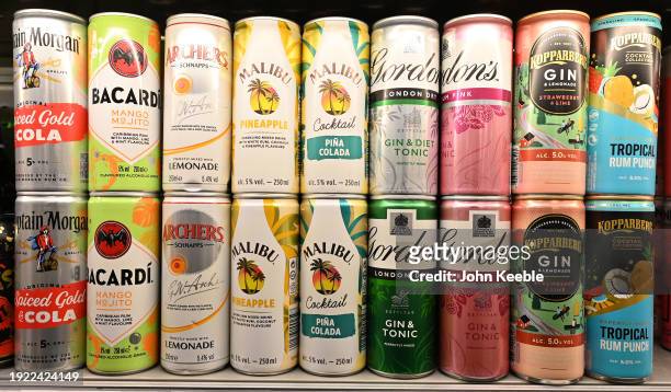 Various cans of alcoholic ready-to-drink beverages including Captain Morgan Rum and Coke, Bacardi MoJito, Archers and Lemonade, Malibu and Pineapple,...