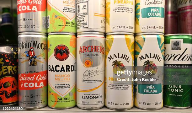 Various cans of alcoholic ready-to-drink beverages including Captain Morgan Rum and Coke, Bacardi MoJito, Archers and Lemonade, Malibu and Pineapple,...