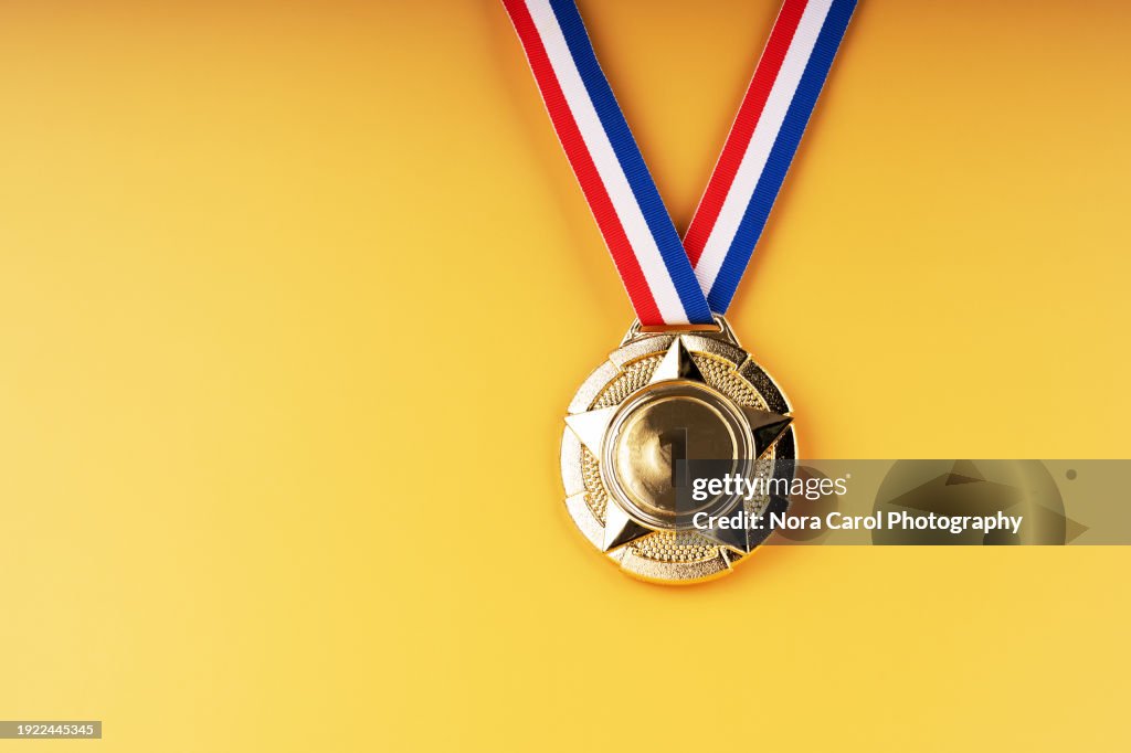 Gold Medal on Yellow Background