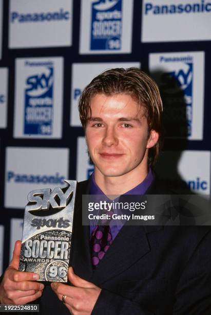 Manchester United player David Beckham pictured with his award at the 1996 Panasonic Sky Sports Football Awards in London, England.