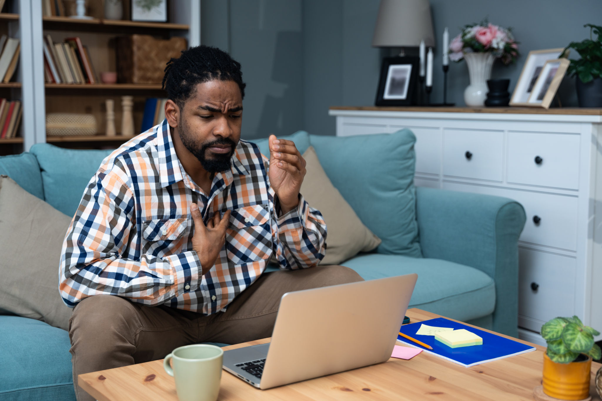 Young black African American man talking on video call with his psychotherapist doctor after online therapy sessions, happy that he is well and mentally health now after telemedicine conversations. Young black African American man talking on video call with his psychotherapist doctor after online therapy sessions, happy that he is well and mentally health now after telemedicine conversations.