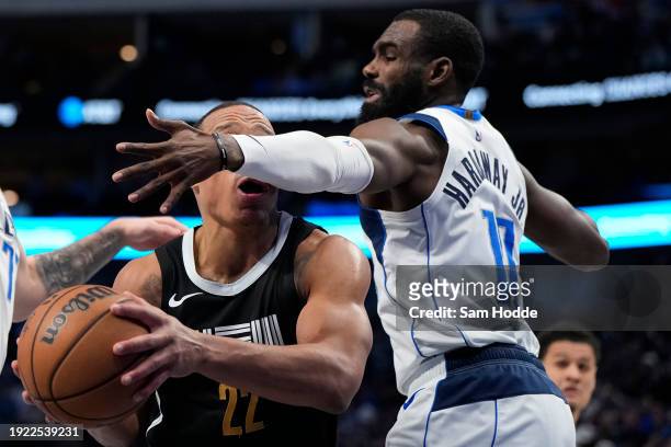 Desmond Bane of the Memphis Grizzlies drives to the basket as Tim Hardaway Jr. #10 of the Dallas Mavericks defends during the first half at American...