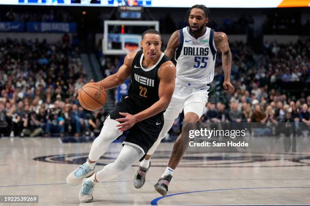 Desmond Bane of the Memphis Grizzlies drives to the basket past Derrick Jones Jr. #55 of the Dallas Mavericks during the second half at American...