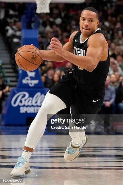 Desmond Bane of the Memphis Grizzlies drives with the ball during the second half against the Dallas Mavericks at American Airlines Center on January...