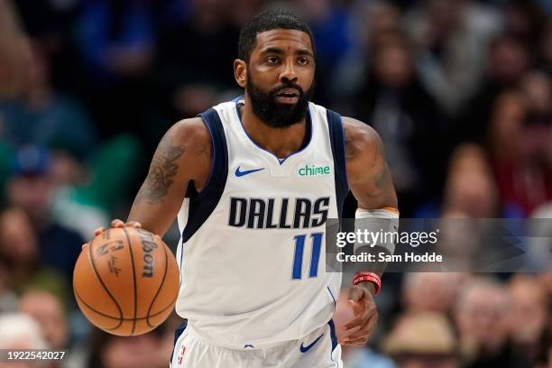 Kyrie Irving of the Dallas Mavericks brings the ball up court during the first half against the Memphis Grizzlies at American Airlines Center on...