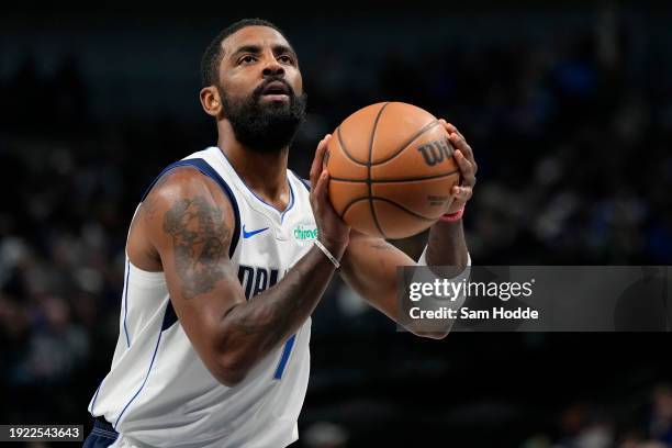 Kyrie Irving of the Dallas Mavericks prepares to take a free throw during the first half against the Memphis Grizzlies at American Airlines Center on...