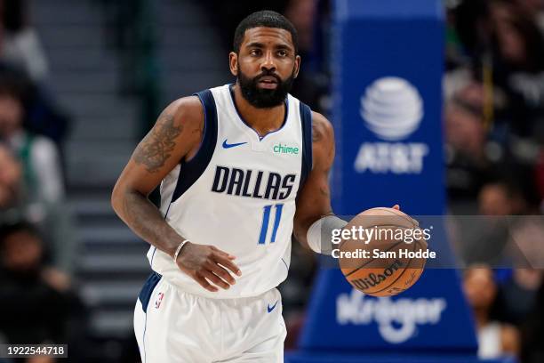 Kyrie Irving of the Dallas Mavericks brings the ball up court during the first half against the Memphis Grizzlies at American Airlines Center on...