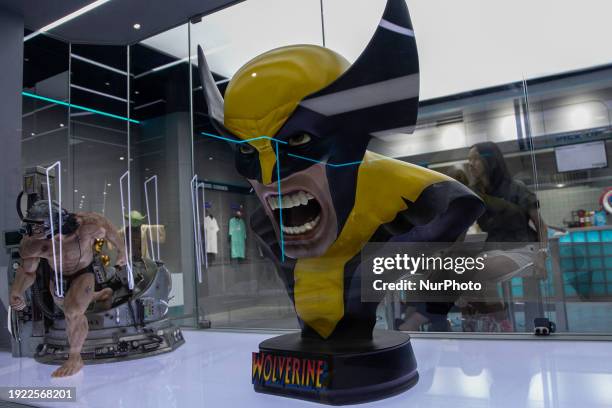 Visitors are enjoying a superhero-themed hangout known as Iconic Arcade, which boasts a large collection of action figures, in Sleman, Yogyakarta,...