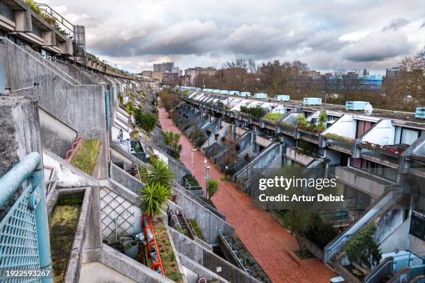brutalism concrete architecture in london with vegetation. - brutalism stock pictures, royalty-free photos & images