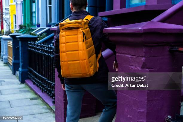 colorful urban style with cool design travel backpack in london. - modern living bricks stock pictures, royalty-free photos & images