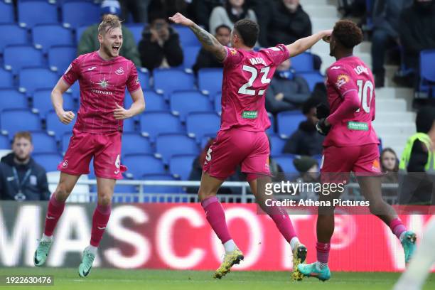 Harry Darling of Swansea City celebrates his goal with Nathan Wood and Jamal Lowe during the Sky Bet Championship match between Birmingham City and...