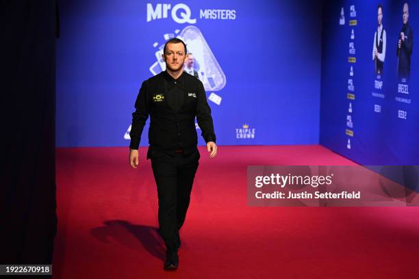 Mark Allen of England walks out after the interval during his first round match against John Higgins of Scotland on day four of the MrQ Masters...