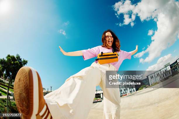 gen z teenager poses full body towards camera, showing attitude - low angle view shoe stock pictures, royalty-free photos & images