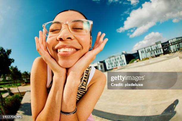 carefree generation z girl in front of blue sky - fischaugen objektiv stock-fotos und bilder