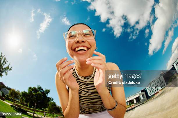 carefree generation z girl in front of blue sky - fisheye stock pictures, royalty-free photos & images