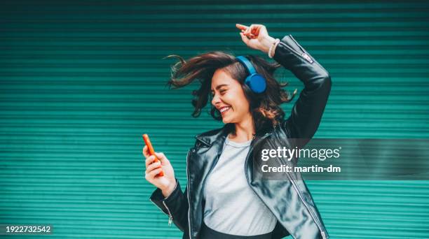 young girl dancing to the music - go go dancer stock pictures, royalty-free photos & images