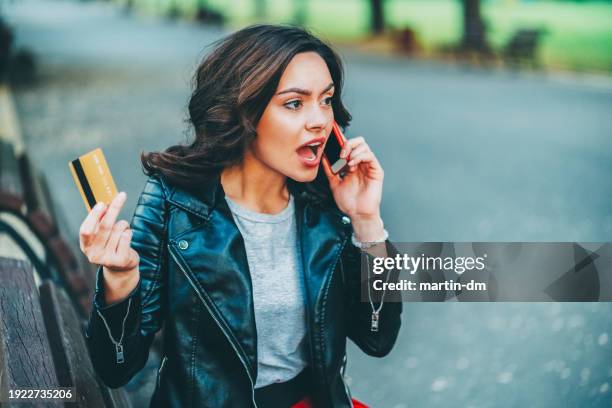 woman victim of credit card fraud - scam victim stock pictures, royalty-free photos & images