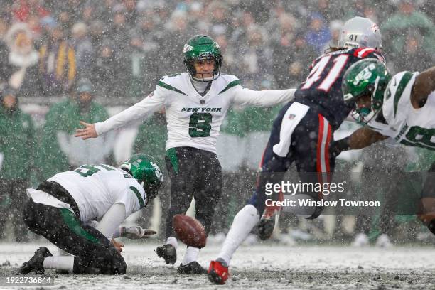 Greg Zuerlein of the New York Jets attempts a field goal in the snow against the New England Patriots at Gillette Stadium on January 7, 2024 in...