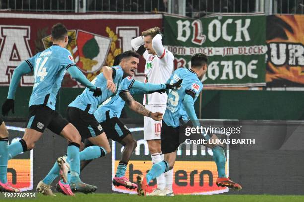 Bayer Leverkusen's Argentine midfielder Exequiel Palacios celebrates scoring the opening goal during the German first division Bundesliga football...