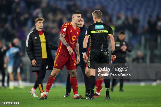 Gianluca Mancini of AS Roma, speaks with match referee Daniele Orsato after the Coppa Italia match between SS Lazio and AS Roma at Stadio Olimpico on...