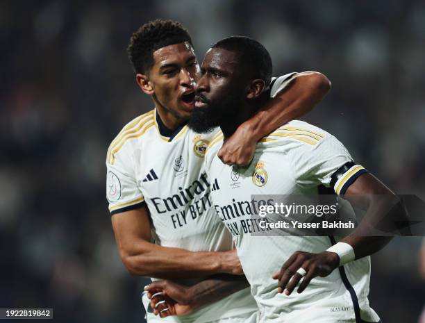 Antonio Ruediger of Real Madrid celebrates scoring his team's first goal with teammate Jude Bellingham during the Super Copa de Espana semi-final...