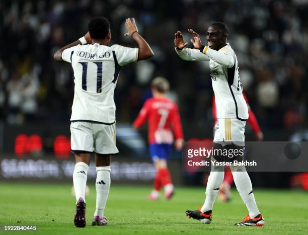 Ferland Mendy of Real Madrid celebrates scoring his team's second goal with teammate Rodrygo during the Super Copa de Espana semi-final match between...