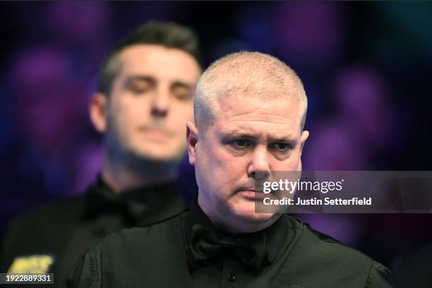 Robert Milkins of England looks on in his first round match against Mark Selby of England during day four of the MrQ Masters Snooker 2024 at...