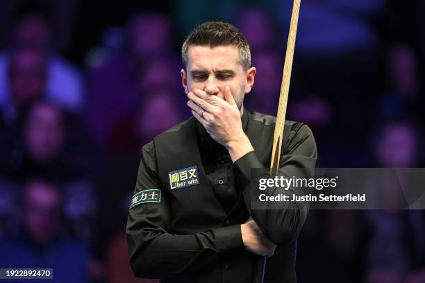 Mark Selby of England reacts in his first round match against Robert Milkins of England during day four of the MrQ Masters Snooker 2024 at Alexandra...