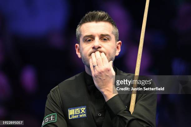 Mark Selby of England reacts in his first round match against Robert Milkins of England during day four of the MrQ Masters Snooker 2024 at Alexandra...