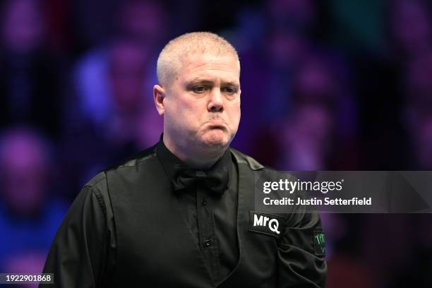 Robert Milkins of England reacts in his first round match against Mark Selby of England during day four of the MrQ Masters Snooker 2024 at Alexandra...