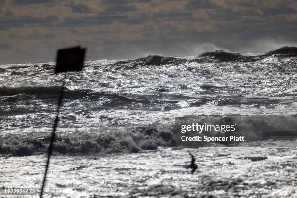 Large waves crash along the beach at Rockaway during heavy surf following a storm that brought high winds and rain to the area on January 10, 2024 in...