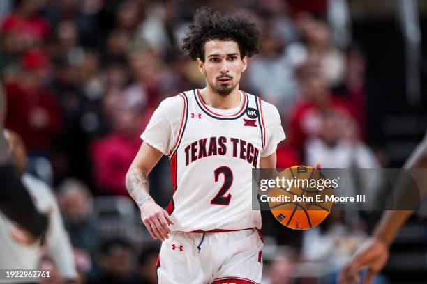 Pop Isaacs of the Texas Tech Red Raiders handles the ball during the second half of the game against the Oklahoma State Cowboys at United...