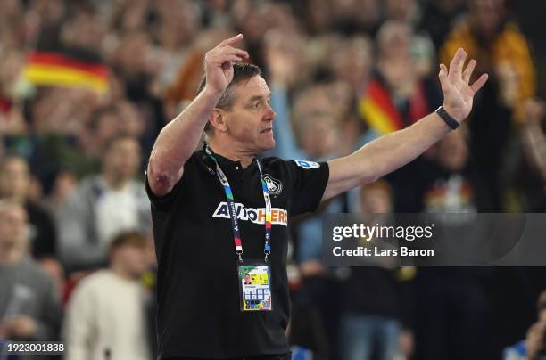 Alfreð Gíslason, head coach of Germany celebrates during the Men's EHF Euro 2024 preliminary round match between Germany and Switzerland at Merkur...