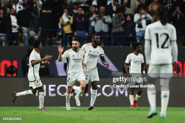 Daniel Carvajal of Real Madrid celebrates scoring his team's third goal with teammates Antonio Ruediger and Rodrygo during the Super Copa de Espana...