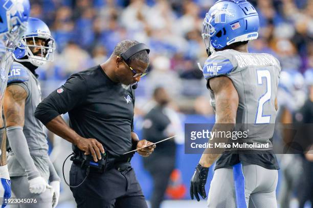 Defensive coordinator Aaron Glenn of the Detroit Lions looks over a play sheet during the second half of a game against the Minnesota Vikings at Ford...