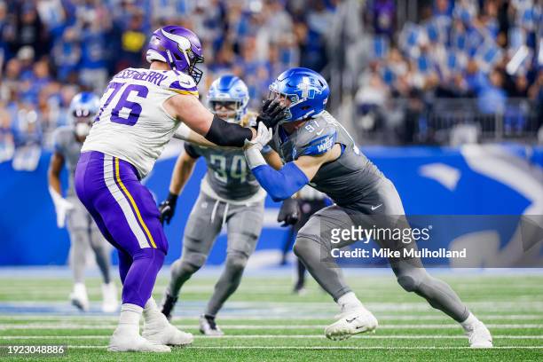 Aidan Hutchinson of the Detroit Lions tries to get by David Quessenberry of the Minnesota Vikings in the second half of a game at Ford Field on...