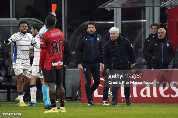 Referee Marco Di Bello shows a red card to Head Coach of Atalanta BC Gian Piero Gasperini who reacts during the Coppa Italia match between AC Milan...
