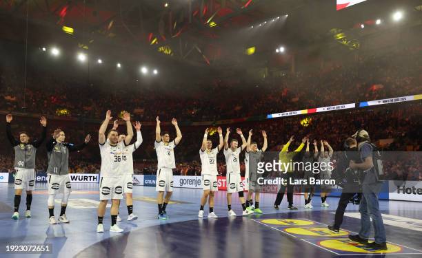 The players of Germany celebrate after the final whistle of the Men's EHF Euro 2024 preliminary round match between Germany and Switzerland at Merkur...