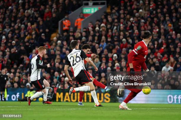 Curtis Jones of Liverpool scores his team's first goal during the Carabao Cup Semi Final First Leg match between Liverpool and Fulham at Anfield on...