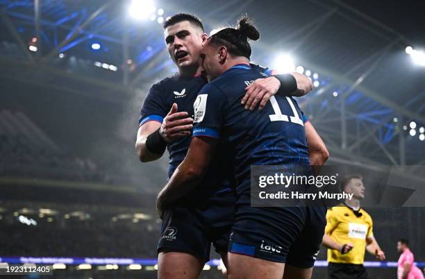 Dublin , Ireland - 13 January 2024; James Lowe of Leinster, right, celebrates with teammate Dan Sheehan after scoring his side's first try during the...