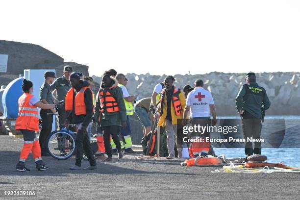 Several migrants are attended to upon arrival at the La Restinga dock, January 10 in El Hierro, Canary Islands, Spain. The Guardia Civil boat, Ri'o...