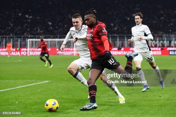 Rafael Leao of AC Milan and Emil Holm of Atalanta BC battle for the ball during the Coppa Italia match between AC Milan and Atalanta BC on January...