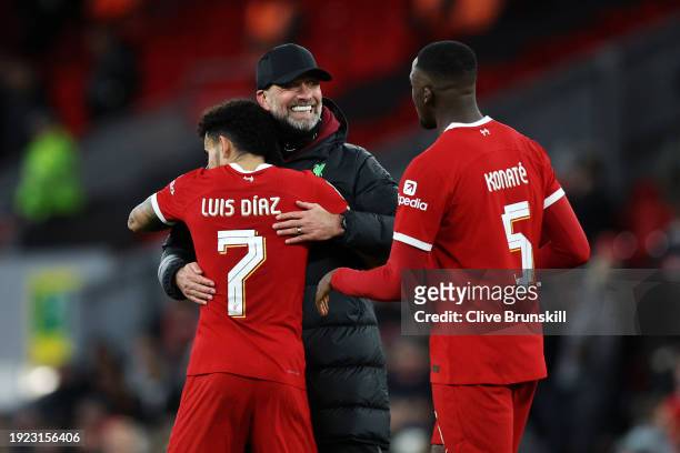 Juergen Klopp, Manager of Liverpool, Luis Diaz and Ibrahima Konate of Liverpool celebrate following the team's victory in the Carabao Cup Semi Final...