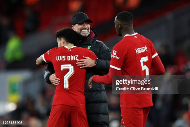 Juergen Klopp, Manager of Liverpool, Luis Diaz and Ibrahima Konate of Liverpool celebrate following the team's victory in the Carabao Cup Semi Final...