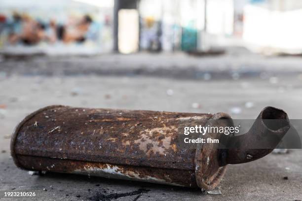 old rusty exhaust pipe of a car in an abandoned workshop - rust   germany stock pictures, royalty-free photos & images