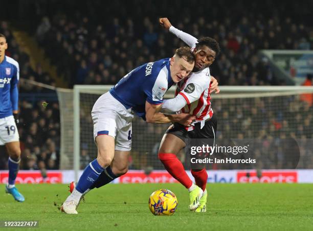 George Edmundson of Ipswich challenges Abdoullah Ba of Sunderland during the Sky Bet Championship match between Ipswich Town and Sunderland at...