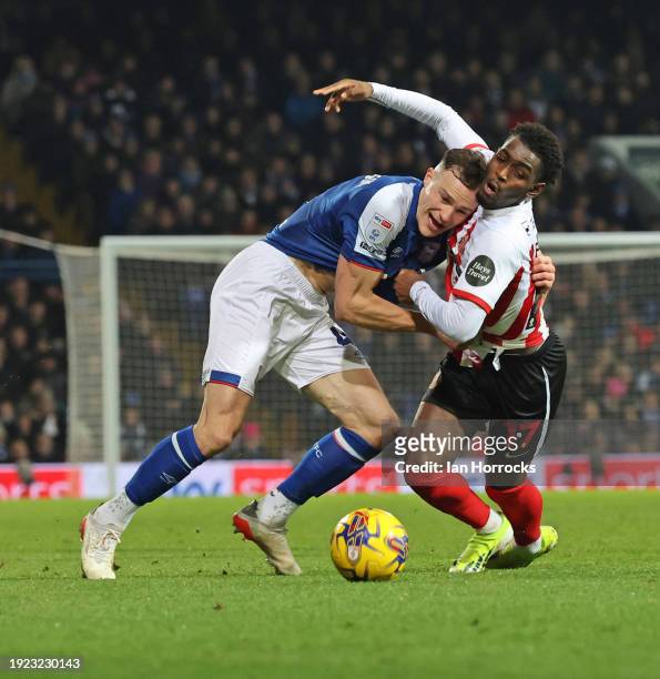 George Edmundson of Ipswich challenges Abdoullah Ba of Sunderland during the Sky Bet Championship match between Ipswich Town and Sunderland at...